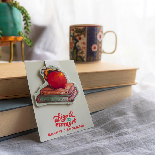 magnetic bookmark of bee biting into an apple