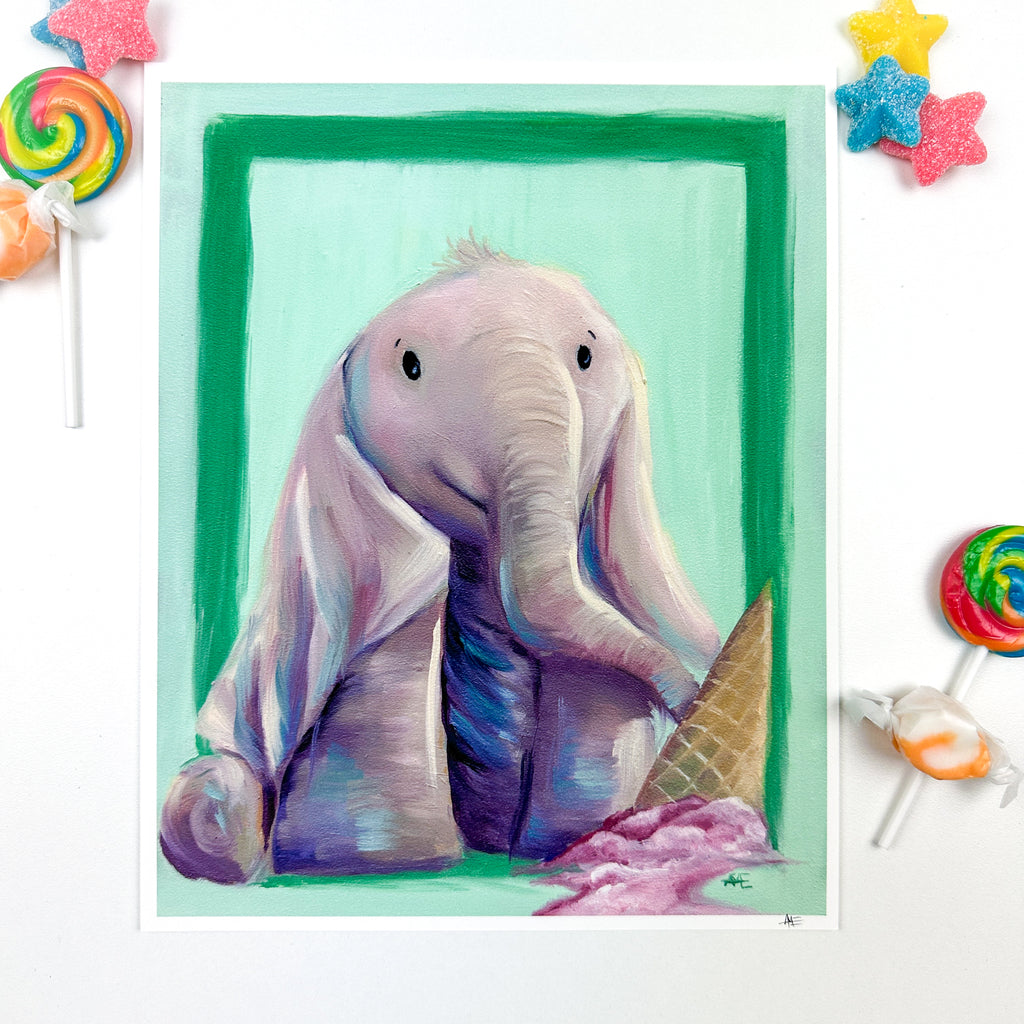 8x10 print of the Elephant with long floppy ears laying over his legs with an upside down ice cream cone in the foreground that has melting pink colored ice cream coming from it