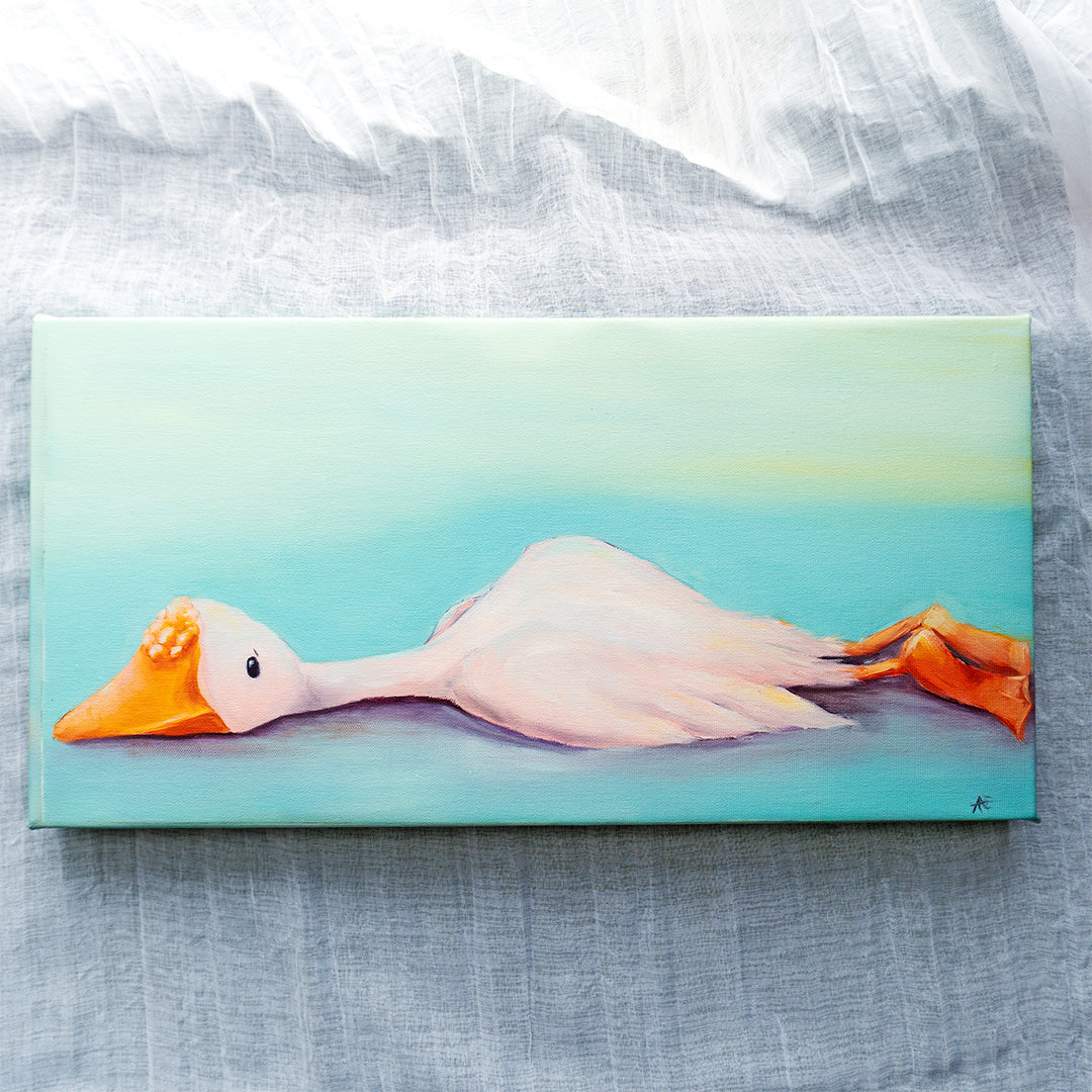 canvas reproduction of a white goose laying down on a textured backdrop.
