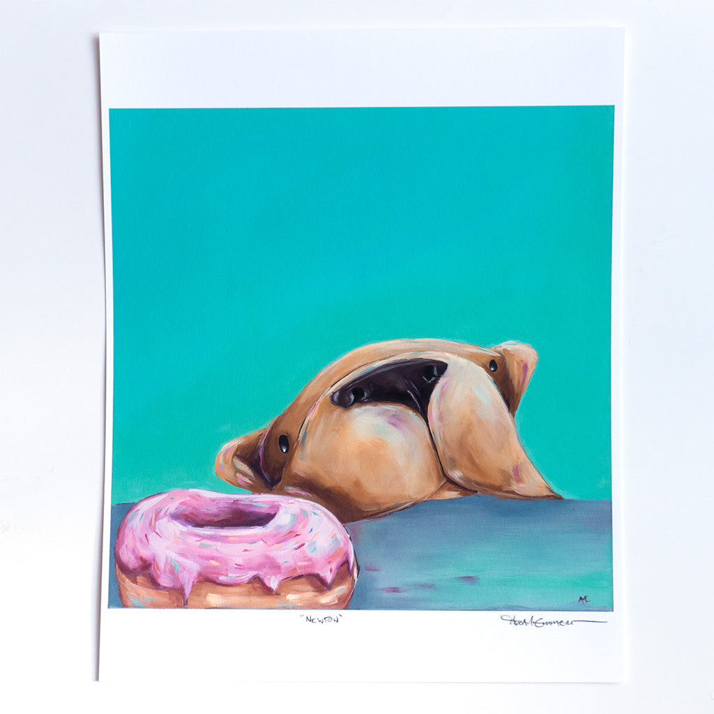 An art print featuring a painting of a dog looking longingly at a donut with sprinkles.