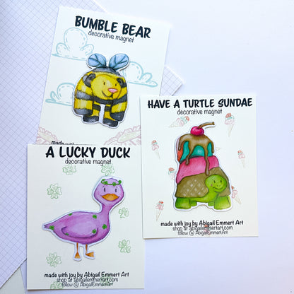 Group of available magnets.  The Bumble Bear, Turtle Sundae and Lucky Duck are all pictures here with their backing cards.
