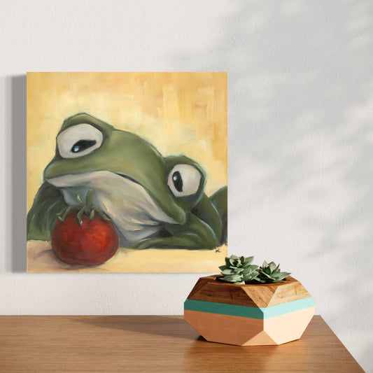 painting of a frog staring longingly at a cherry tomato hanging on a wall above a wooden surface with a geometric plant holder.