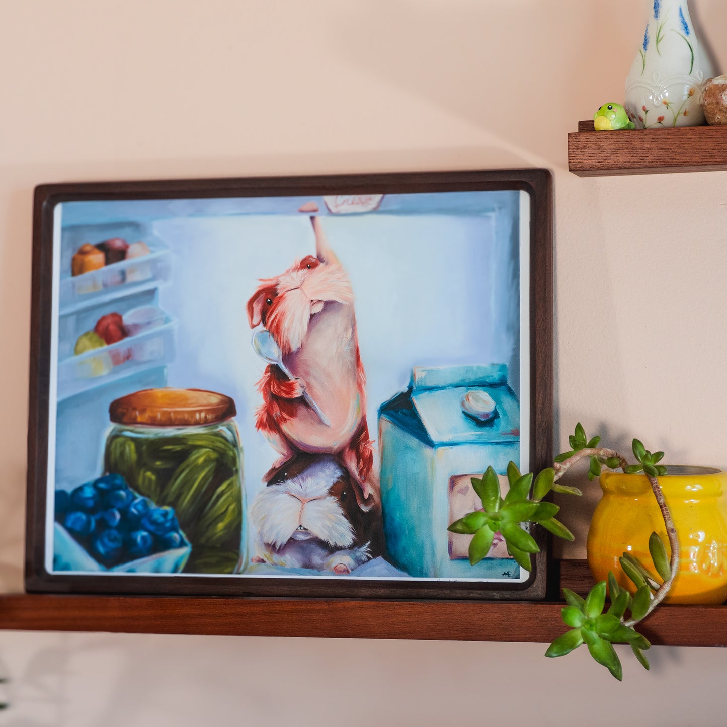 2 GUINEA PIGS IN A FRIDGE, ONE IS REACHING FOR THE ICE CREAM.  THIS IS A FRAMED PRINT EXAMPLE OF 11X14" SIZE.