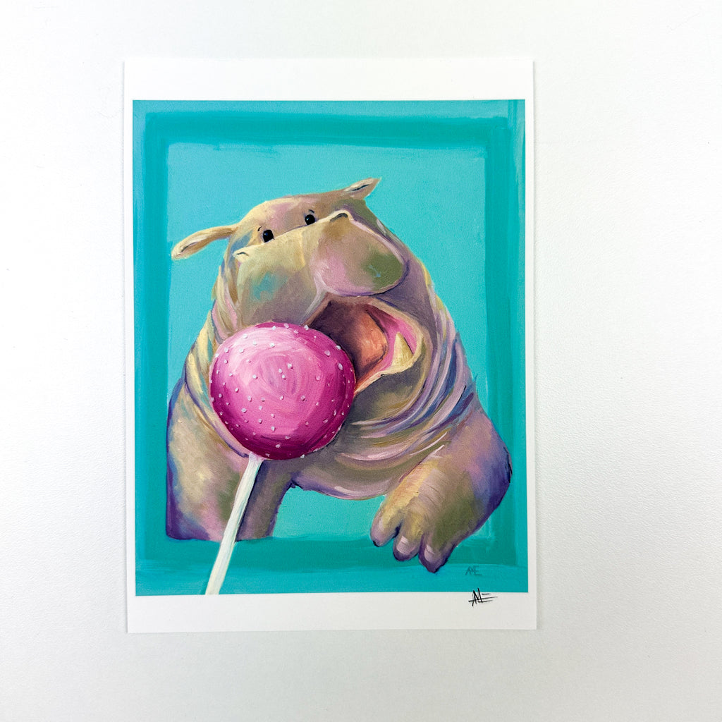 fine art print of cute kawaii style hippo busting out of a border and open mouth going after a pink cake pop