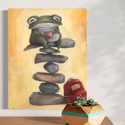  artwork of a frog balancing on stones against a yellow background, with a plant in the foreground.