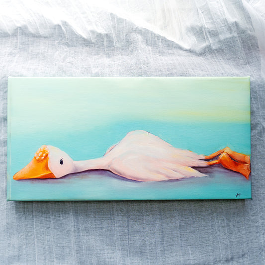 canvas reproduction of a white goose laying down on a textured backdrop. 