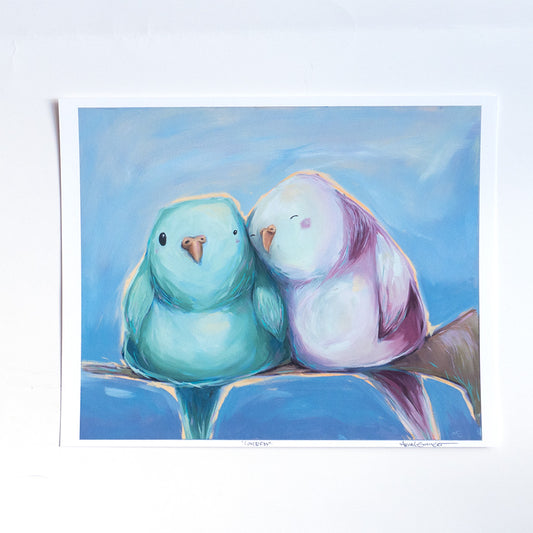 Art print featuring two stylized birds sitting close to each other on a branch with a blue background.
