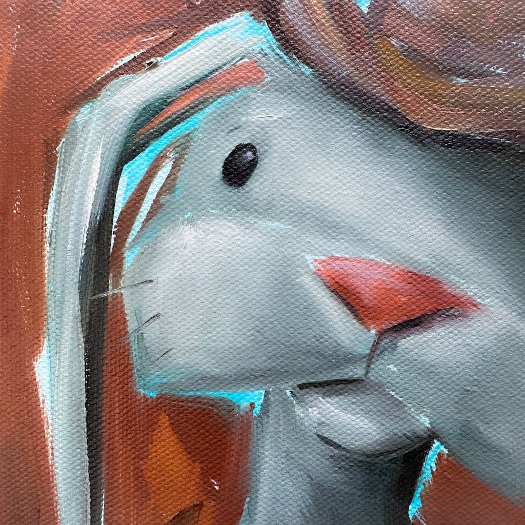 close up of the cowboy bunny eye, showing the bright blues highlighting portions of his head. 