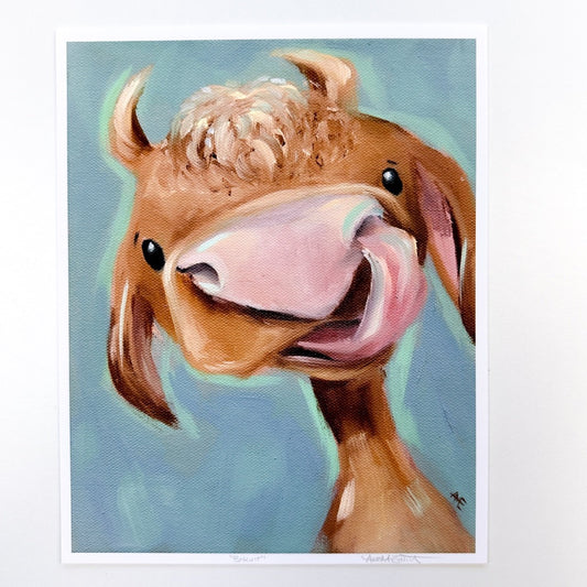 tan cow with tongue picking nose