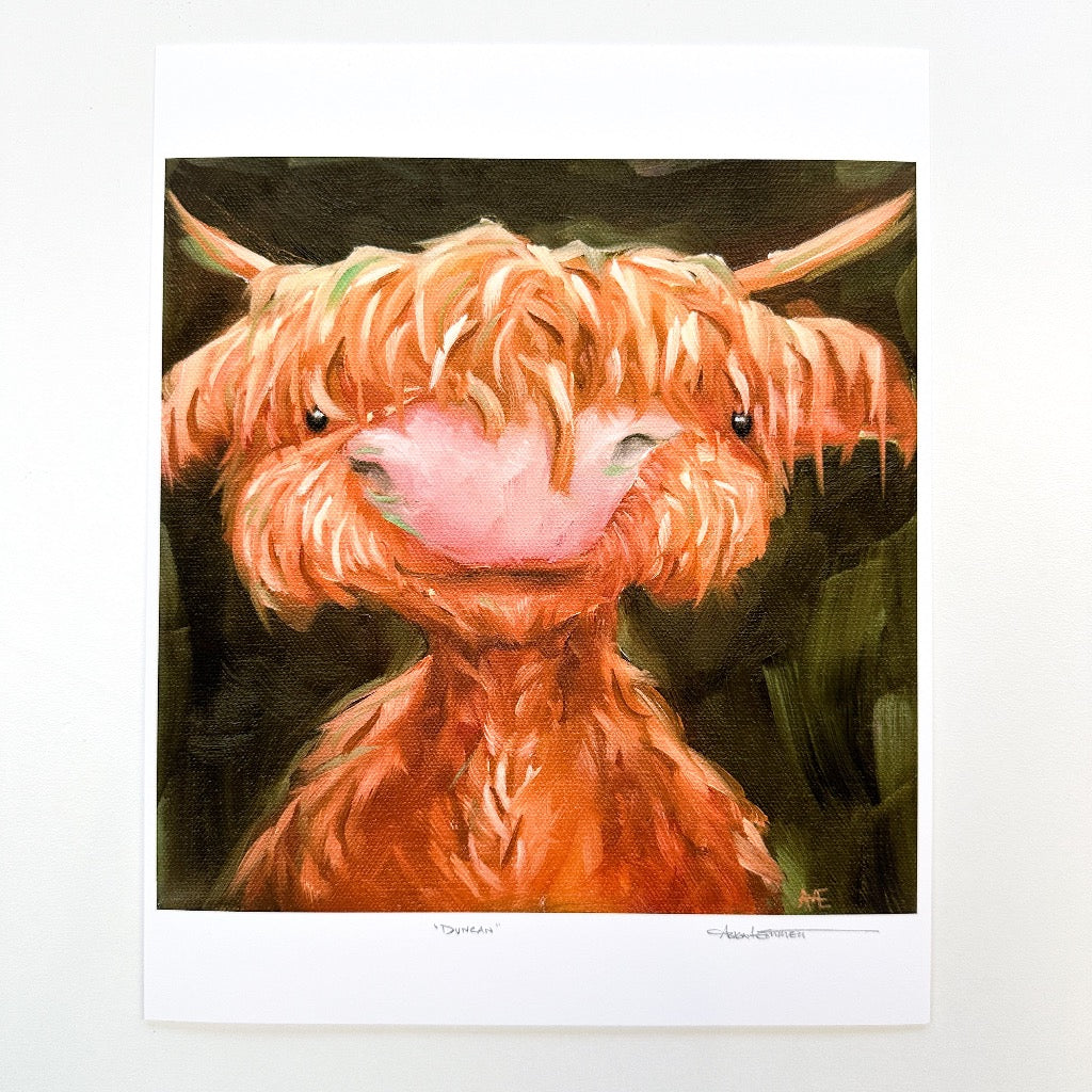 art print of a highland cow with a sweet expression on his face and a dark green background.  